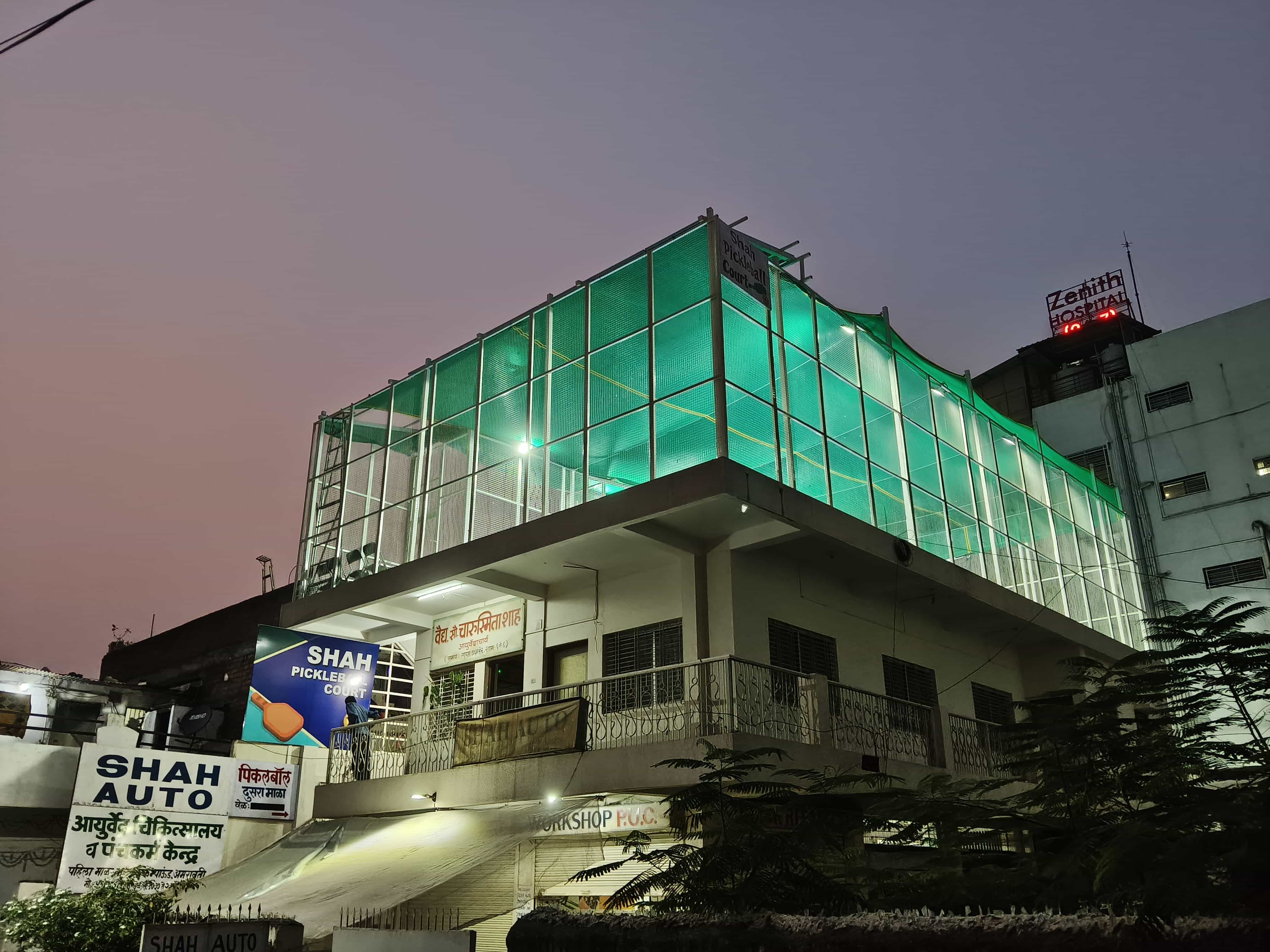 Shah Pickleball Court rooftop court lit up at night, Amravati